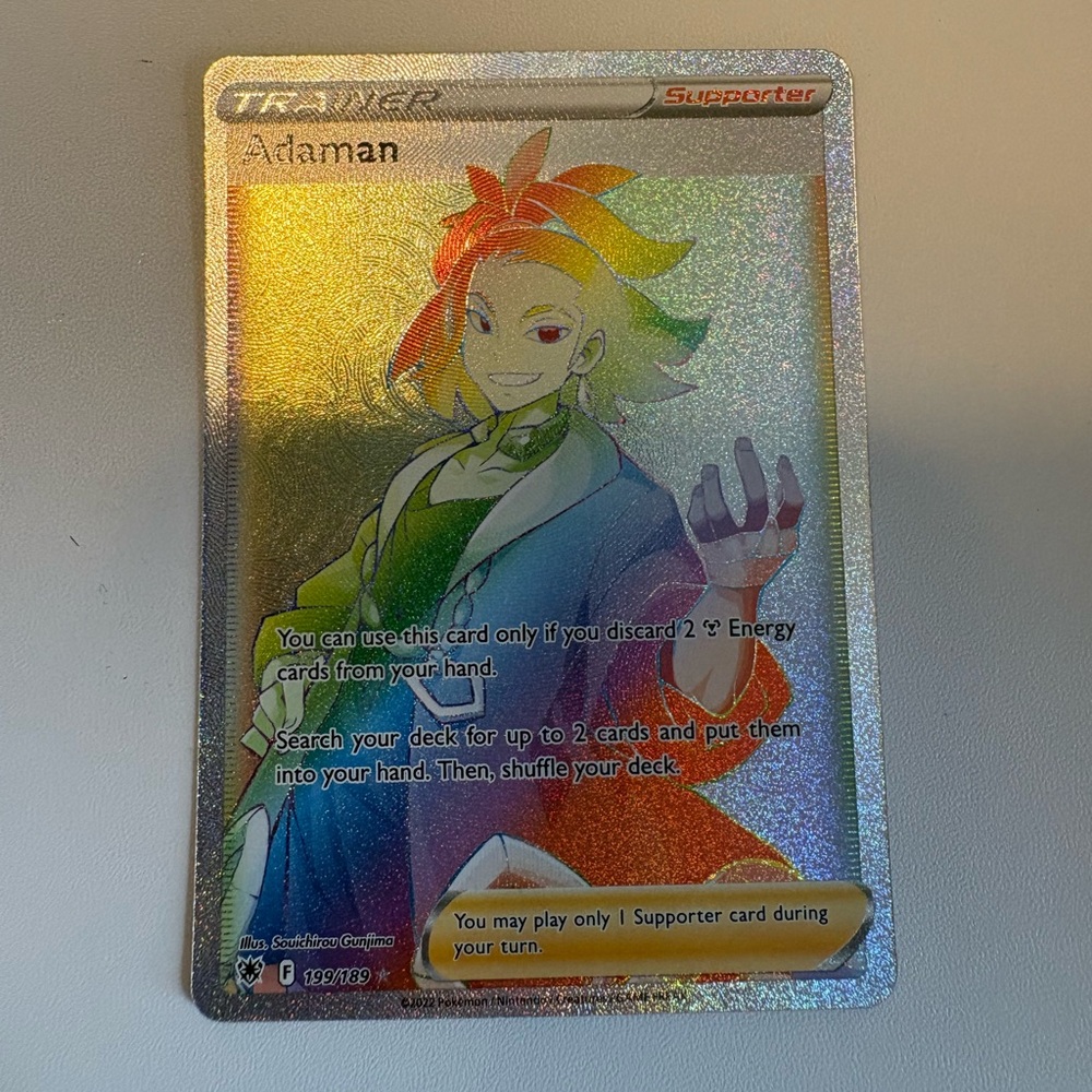 Adaman Pokémon Trainer Full Art Holo Card - Rainbow Foil